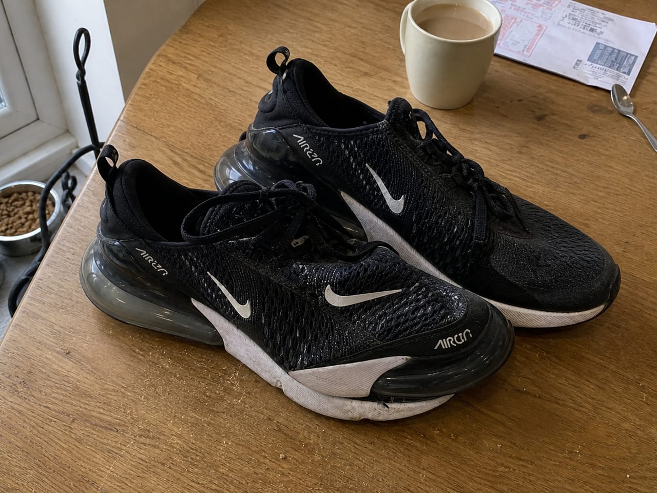 Overhead phone photo of the same Nike trainers, demo